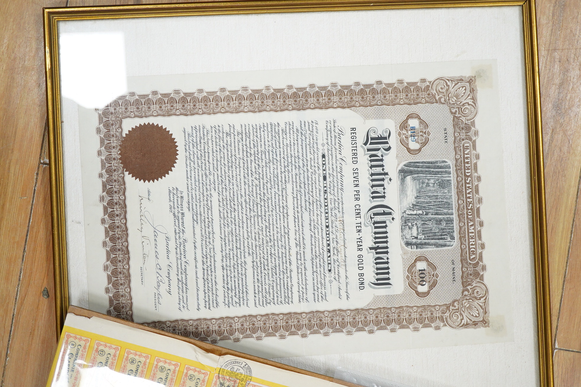 Share certificates, two framed to include McIntyre Porcupine Mines Ltd